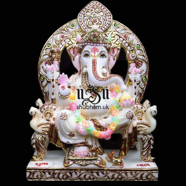 Beautiful Ganesha Seated on Peacock Sinhasan - 13 inch Beautiful Ganesha Seated on Peacock Sinhasan - 13 inch